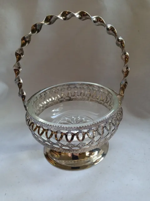 Vintage silver plate basket with glass insert. Candy dish/relish dish England