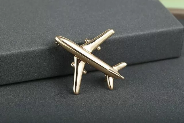 Broche alfiler de bisutería Avión de pasajeros de acero dorado.