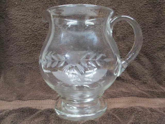 Vintage Clear Glass pitcher with etched Flowers And Leaves very nice piece