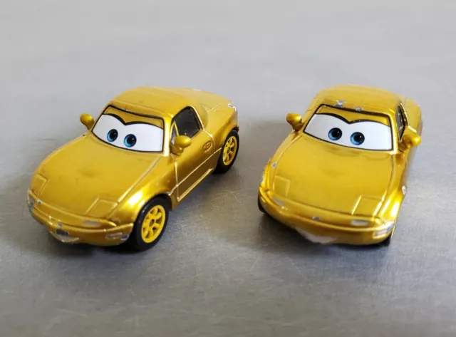 DISNEY PIXAR 2 Voitures Cars METAL 1/55 Die Cast - MIA et TIA Gold Doré Or