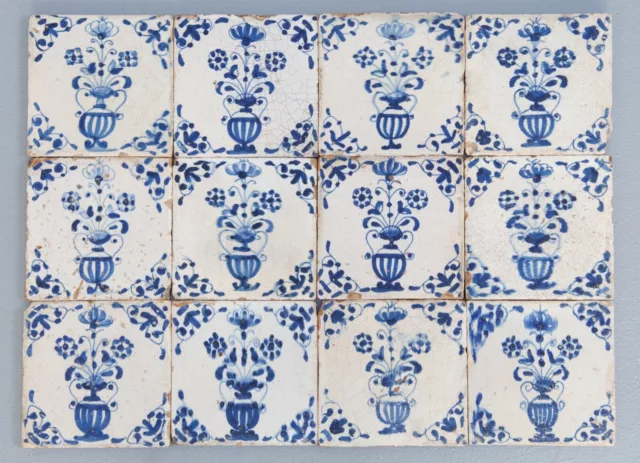 Nice field of 12 Dutch Delft Blue tiles, flowerpots, first half 17th. century.