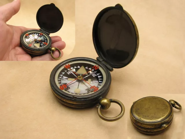 Antique brass cased pocket compass with mother of pearl dial. Circa 1900.