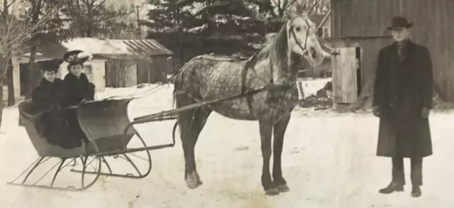 Antique RPPC Photo Horse Drawn Sleigh Man Women Fancy Hats Winter Snow WI #51
