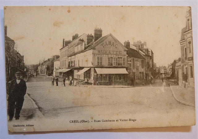 E19 / Dept 60 Cpa Creil Rue Gambetta Et Rue Victor Hugo Le Cafe Buvette Animee