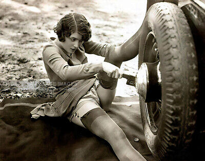 1930s Studio Biederer Photo Woman in Stockings Changing Car Tire - 11x14 Poster