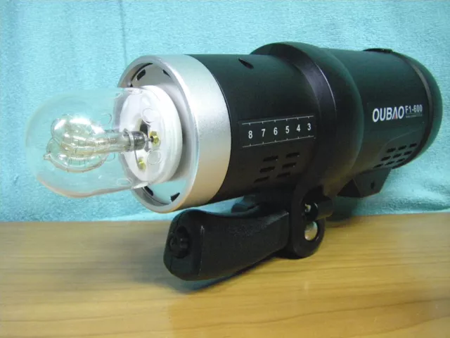 Flash de estudio portatil OUBAO TRIOPO F1-600 y disparador G1 para camara fotos. 3