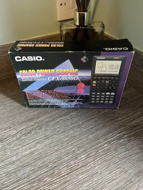 CASIO CFX 9850G SCIENTIFIC calculator and manual. Boxed and
