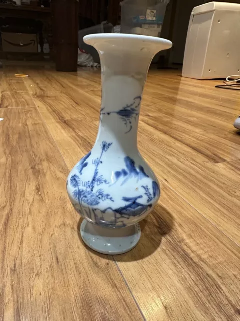 old Chinese blue white porcelain vase lots of imperfections. 7.25”
