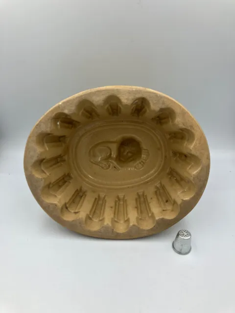 Vintage ceramic jelly mould with lion design. Victorian kitchen mould.