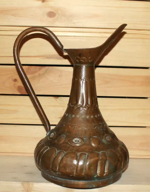 Antique Middle East hand made ornate wrought copper pitcher jug