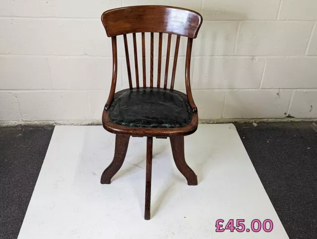 Antique swivel chair, with leather upholstered seat