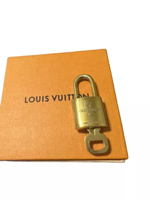 Authentic Louis Vuitton lock and key set #320 Gold Hardware