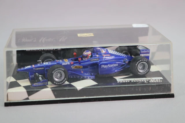 Miniature F1 Minichamps 1/18 - Prost Peugeot AP01 D'Olivier Panis 1998 (état Neuf, Boîte Incluse)