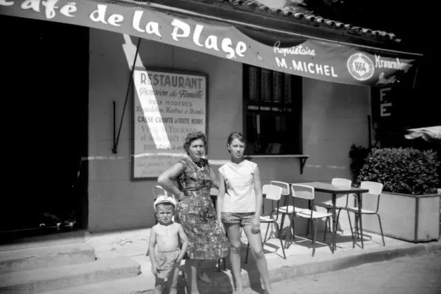 Family in front of Café de la Plage - old photo negative year. 1950 60