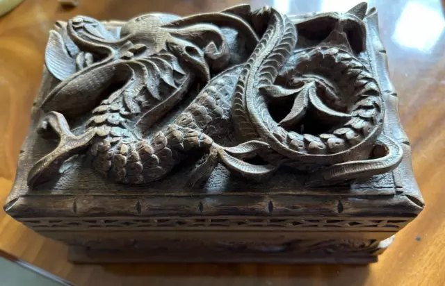 Wooden Chinese hand carved dragon box in deep relief with removable compartments