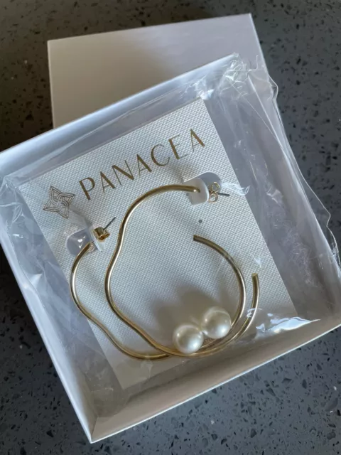 Panacea Gold Tone Curvy Large Hoop Style Earrings With A White Pearl