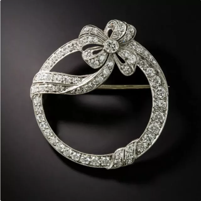 Attractive Circle Bow Design with Single Cut White Stone Princess Silver Brooch