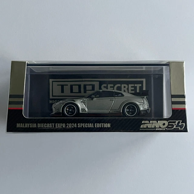 INNO64 Top Secret MDX INNO64 Nissan GT-R R34 TOP SECRET - Modellino 1:64 In Die-Cast, Edizione Speciale Salone Di Tokyo 2024, Colore Oro Nissan Skyline Gtr R34 - Foto 4
