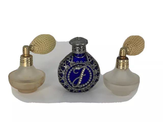 Sold at Auction: A GROUP OF ANTIQUE AND VINTAGE PERFUME BOTTLES