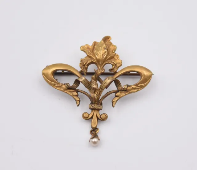 Broche à transformation en plaqué or fixe Art Nouveau décor d'iris et fleur lys