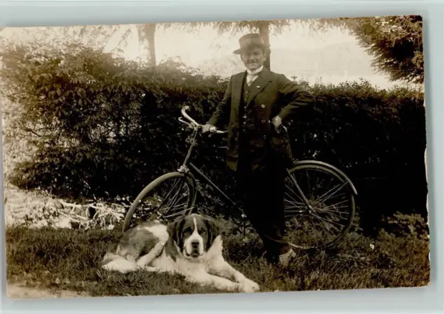 12085280 - Mann mit einem Fahrrad und seinem Hund schoene Foto 1920 AK