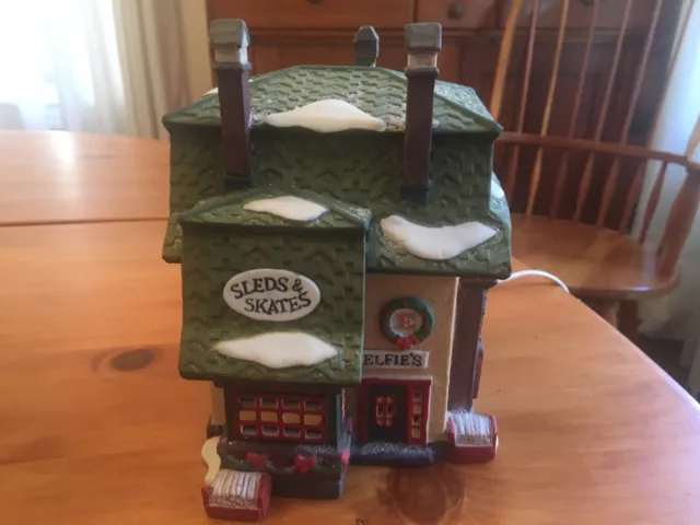 Dept 56 - North Pole Series - Elfie’s Sleds and Skates  Christmas Village
