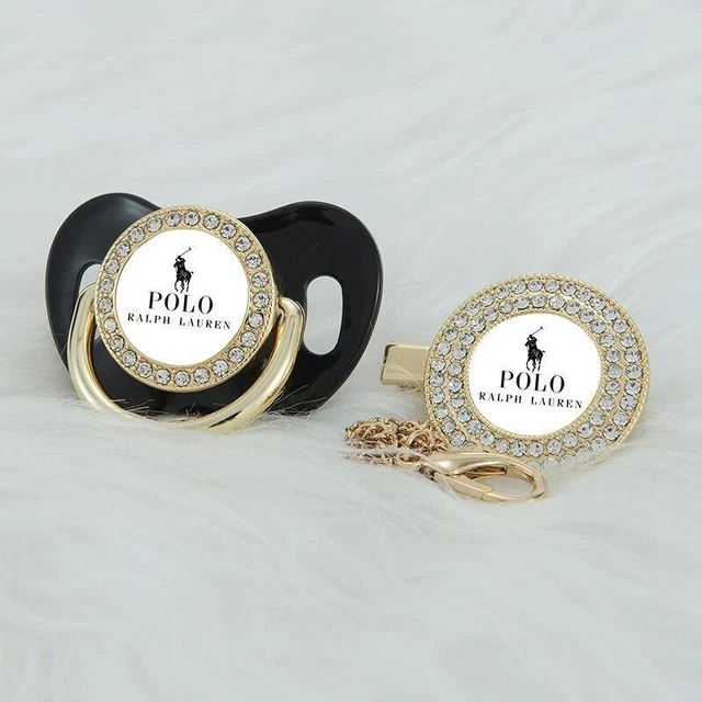 Chupete bebé polo con cadena negro oro 0-6 M aspiradora de pedrería