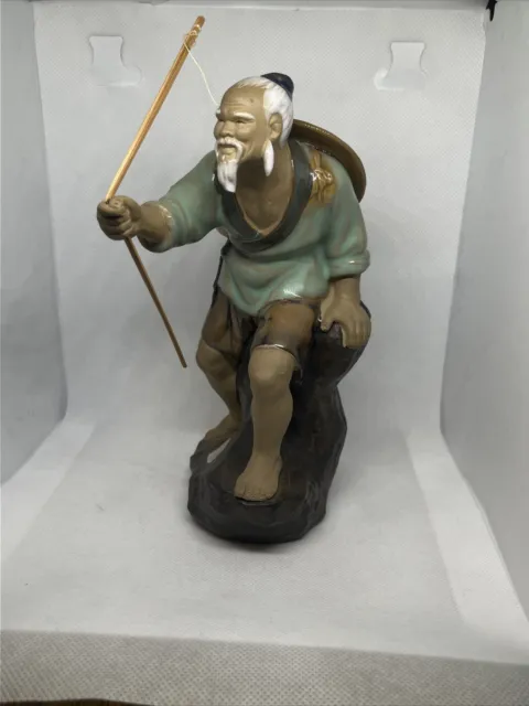 Rare find Chinese Mudman Ceramic Figurine, depicting man with bow