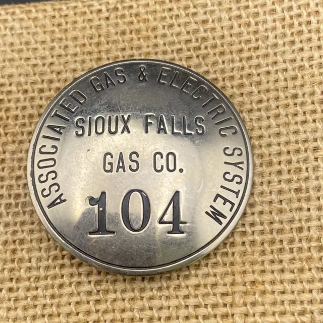 Vintage Sioux Falls Gas Co. employee badge 104, Associated Gas & Electric System