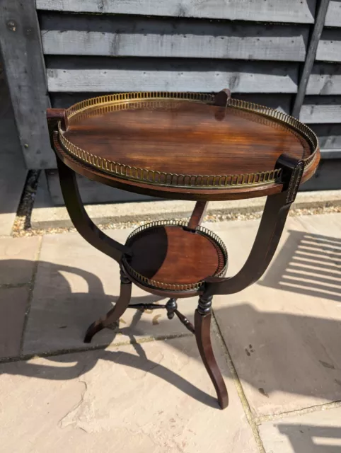 Antique decorative polished wooden display table with metal trim