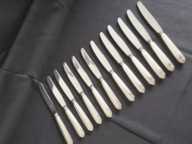 Six Couverts à poisson en métal argenté, modèle uniplat. MO Ravinet