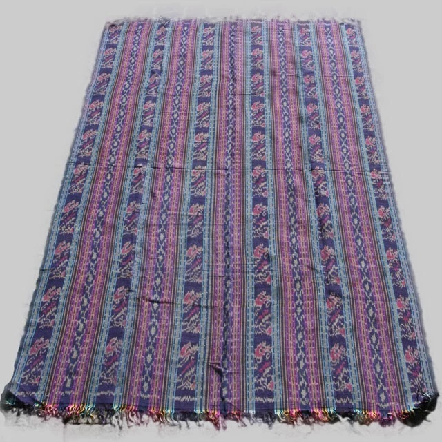 Beautiful plant-dyed, hand woven cotton warp ikat from Sumba island, Indonesia