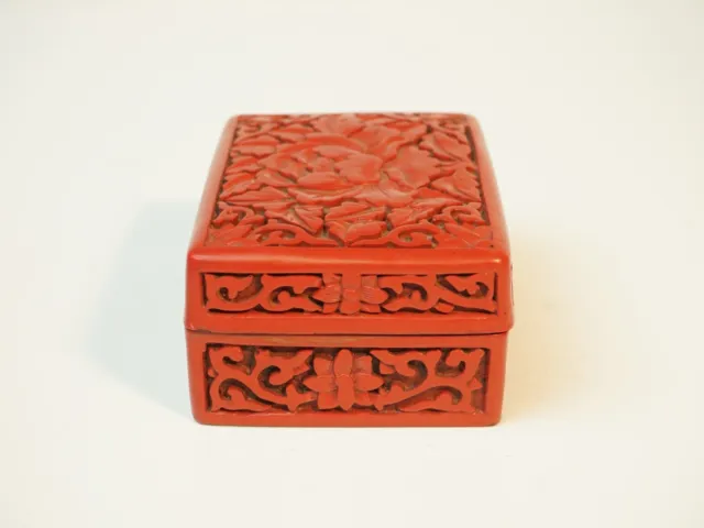 A Rectangular Chinese Cinnabar Lacquer Box and Cover With Penny