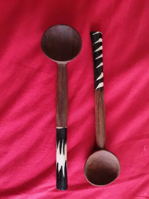 Vintage carved African wooden spoons with bovine bone decoration