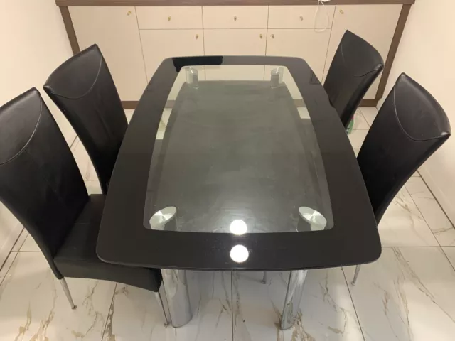 Harveys black glass dining table deals