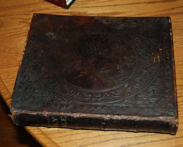 1873 Holy Bible 12" x 9.5" illustrated, leather covers embossed with an angel