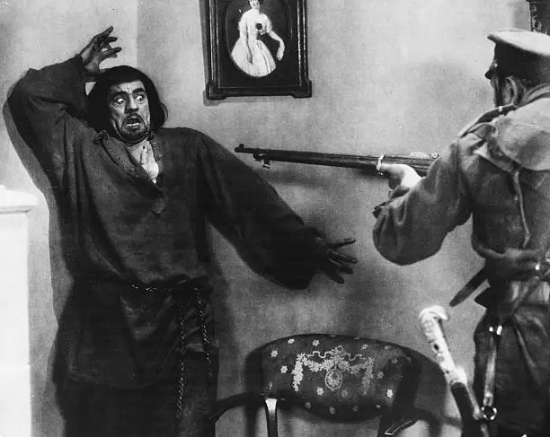 Lon Chaney being held at gunpoint, in a scene from the movie 'M - 1927 Old Photo