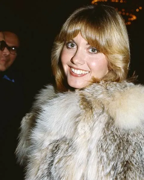 Olivia newton John smiling 1970's off-screen pose in fur coat 8x10 inch photo