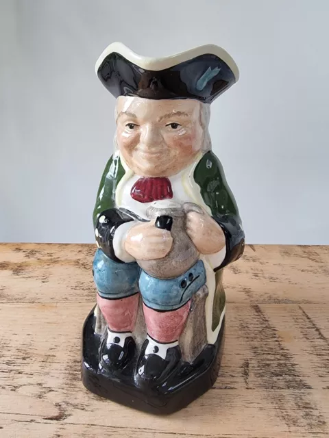 Staffordshire Fine Ceramics hand painted toby jug. Made in England. Green jacket