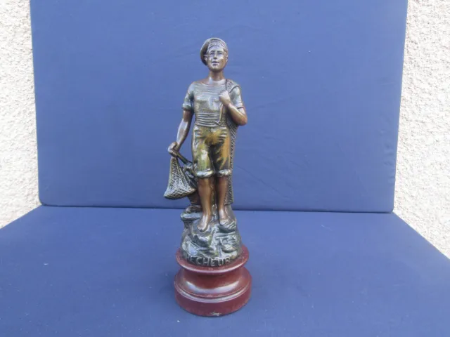 Petite statuette sur socle en régule " Pêcheur " non signé, XXème, 28cm env.