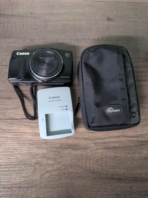 Cámara digital Canon PowerShot SX710 HS 20,3 MP y cargador de estuche funcionando
