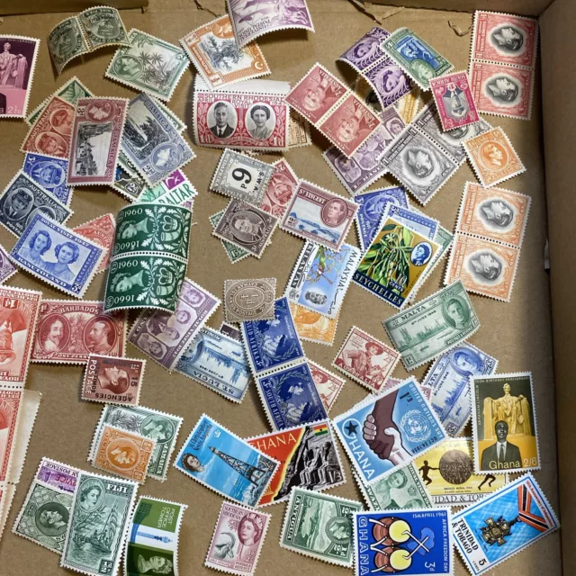 Old Commonwealth Stamps in a box - All Mint - Various Condition