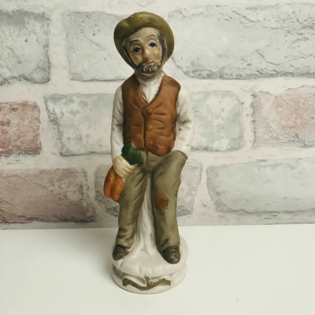 Vintage Ceramic Figurine of an Old Man Sitting on a Tree Stump Holding Carrots