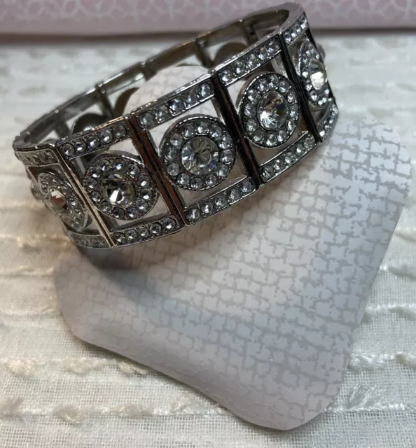 Silver tone with clear crystals stretchy bracelet.