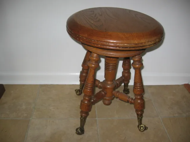 Antique Oak Wood ,  brass Footed Adjustable Height Piano Stool