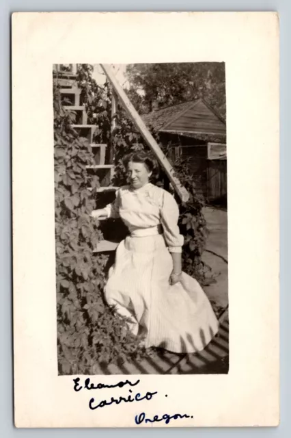 RPPC Lady in Striped Dress Sits on Wooden Stairway VINTAGE Postcard 1374