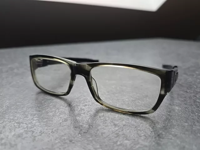 Oakley Currency Black Grey Brille Brillengestell Muffler