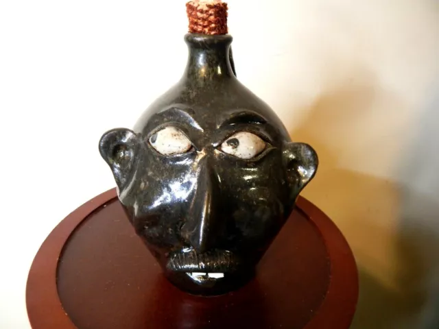 wayne hewell  face jug, pottery, folk art  9''x 7''