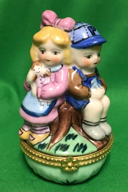 Ceramic Vintage Trinket Box Kida Boy And Girl with a Baby On a Stump