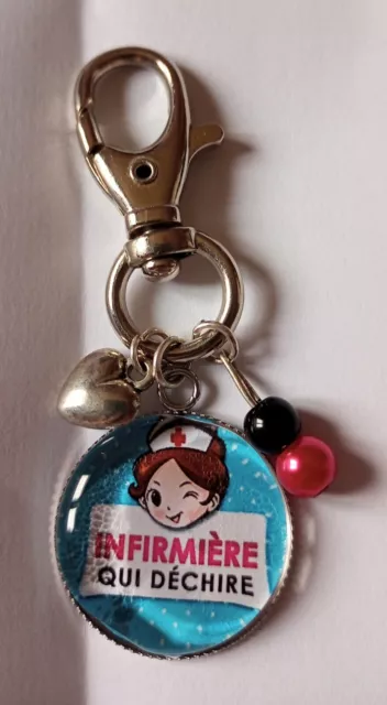 Porte Clefs Cabochon infirmière qui déchire